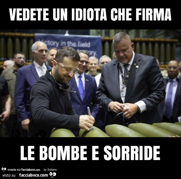 Vedete un idiota che firma le bombe e sorride